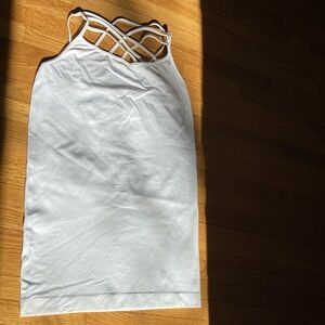 Yelete white camisole with cross cross design. One size